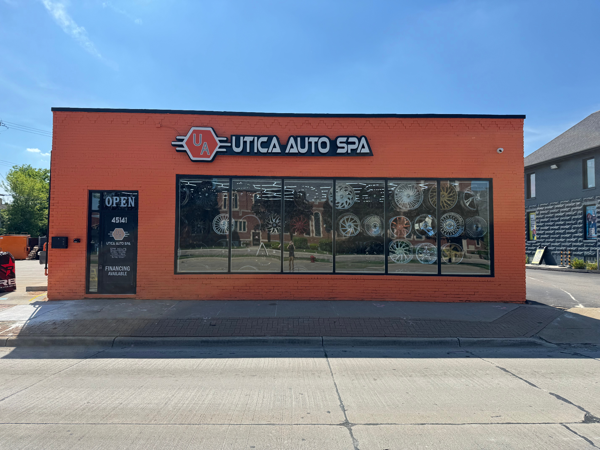 Updated front exterior photo of the Utica Auto Spa showroom on Van Dyke Ave in Utica, Michigan